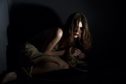 woman victim of human trafficking with tied hands