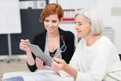 older employee working with younger one