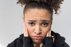 Closeup of upset woman's face