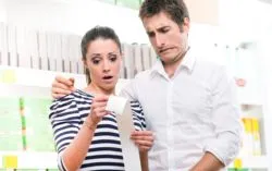 couple looking at expensive Apple receipt