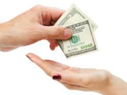 close up of hands passing money