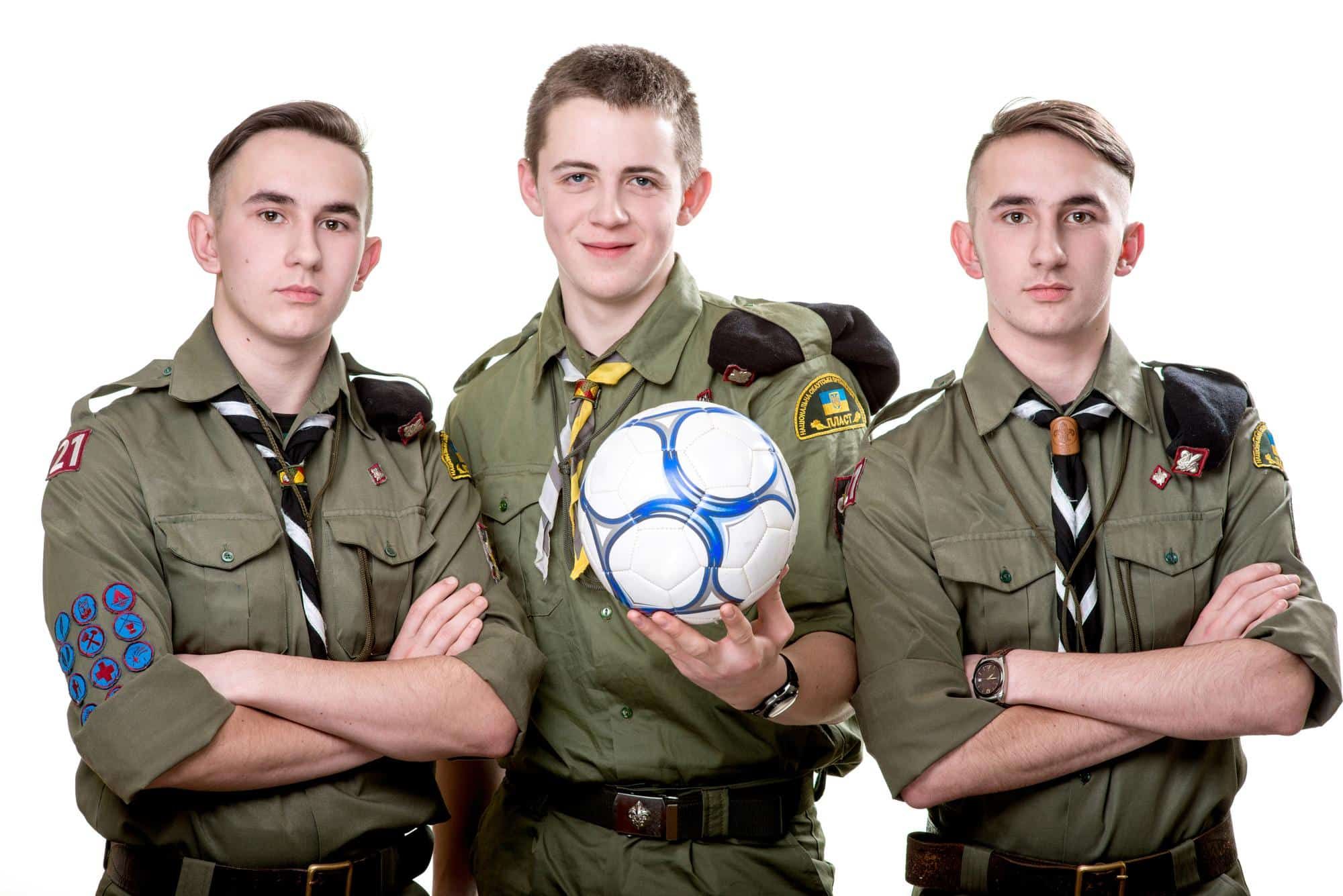 three teenage boy scouts