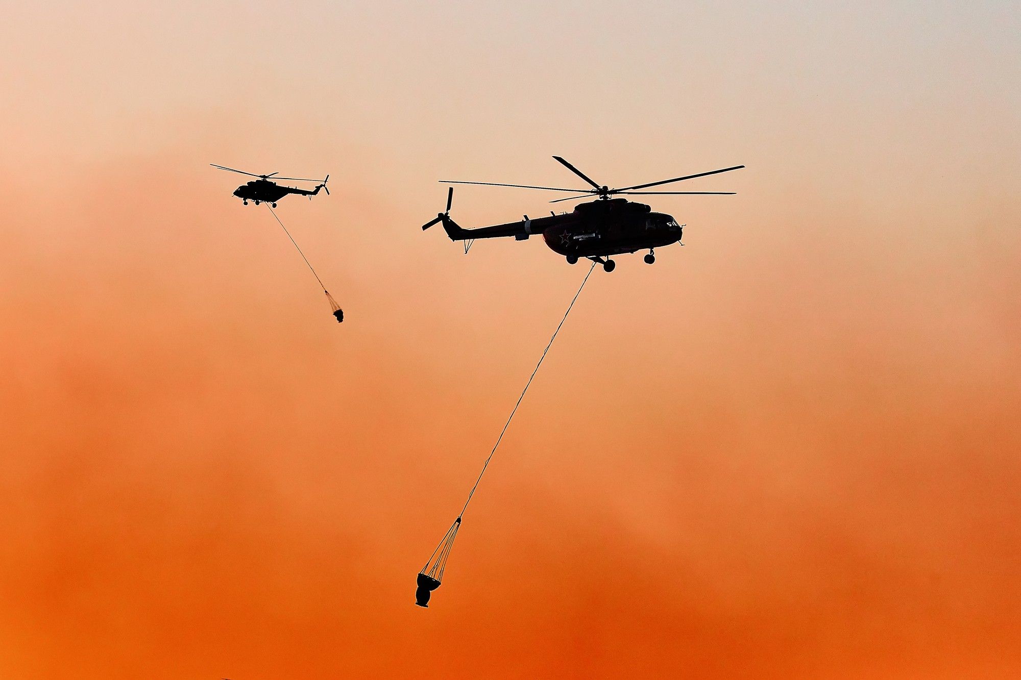 Two helicopters used for firefighting