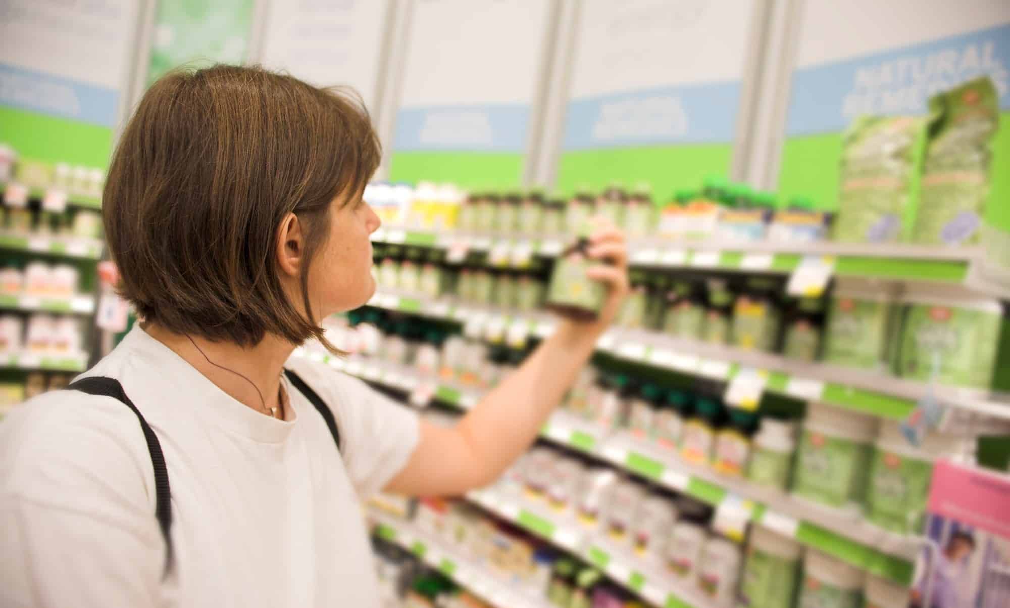 woman buying over the counter drugs