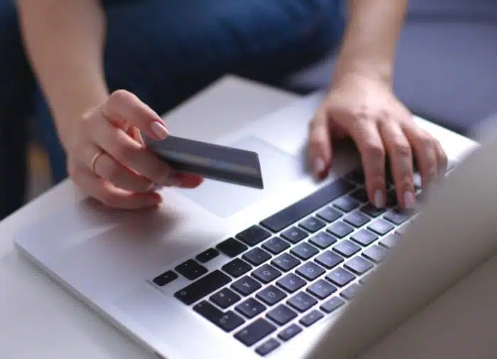 woman paying for clothing on Nasty Gal's website
