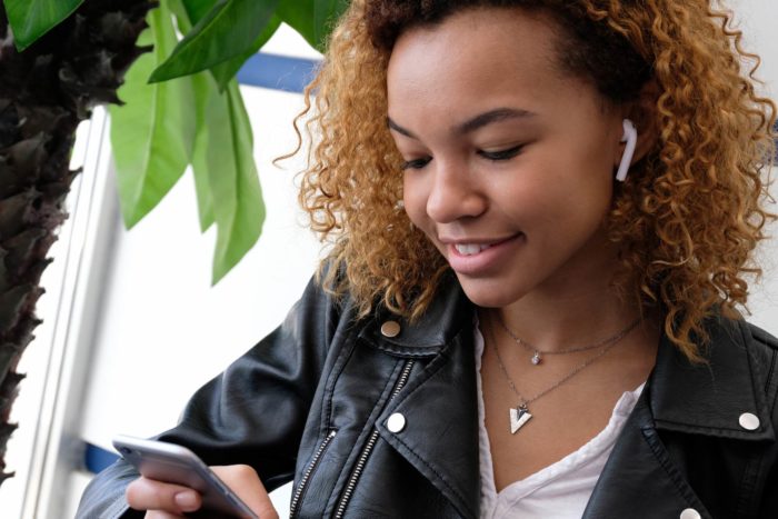 woman listening to music with AirPods