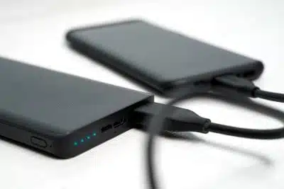 Smartphone plugged into portable power bank