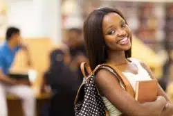 Smiling female student at campus library