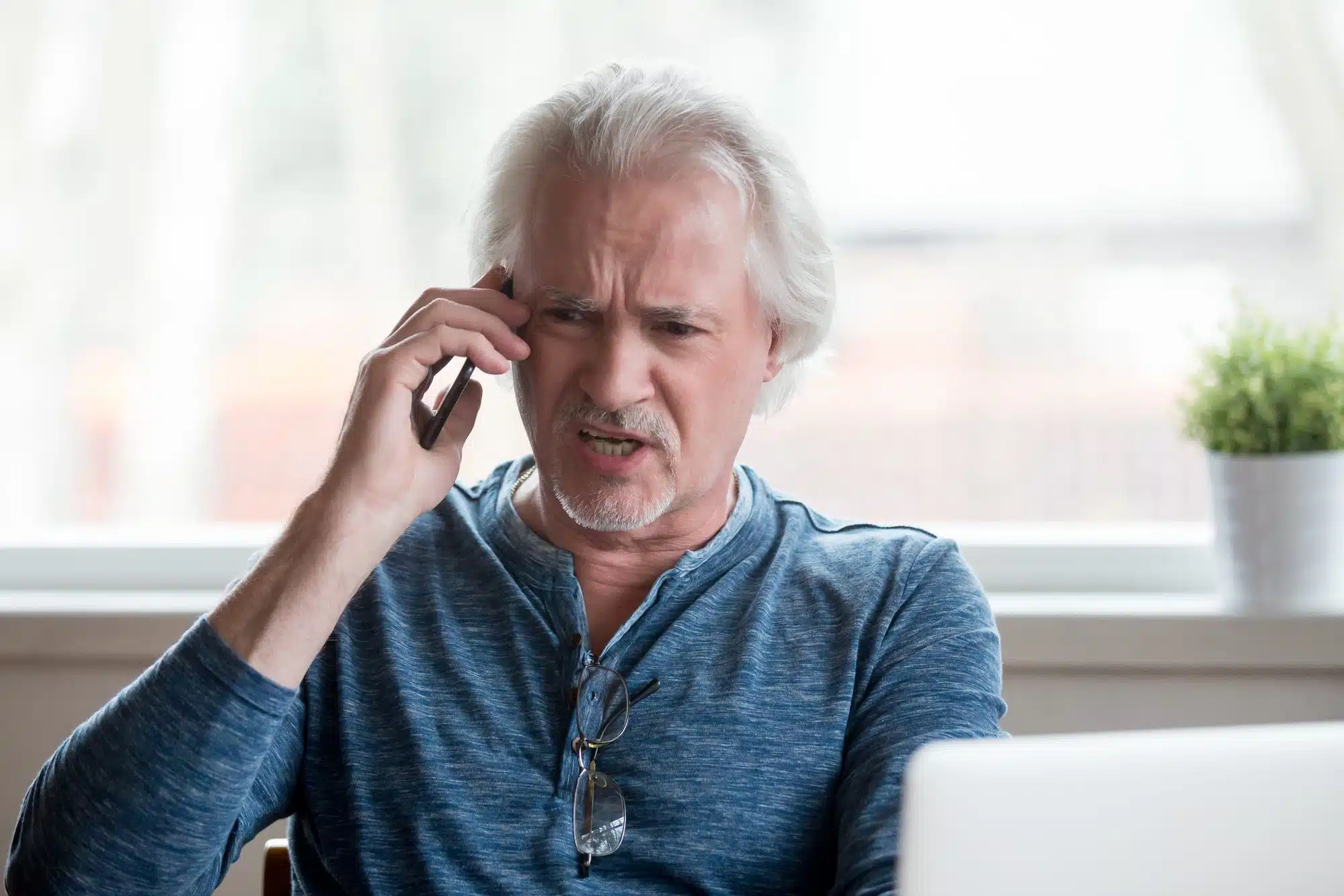 man receiving unwanted spam call