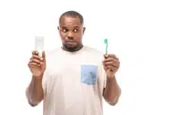 Brushing teeth with Tom's of Maine
