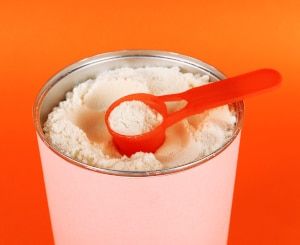 baby formula in a canister with a scoop