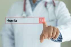 What risks are associated with hernia mesh surgery?