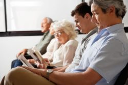 people in doctor office waiting room