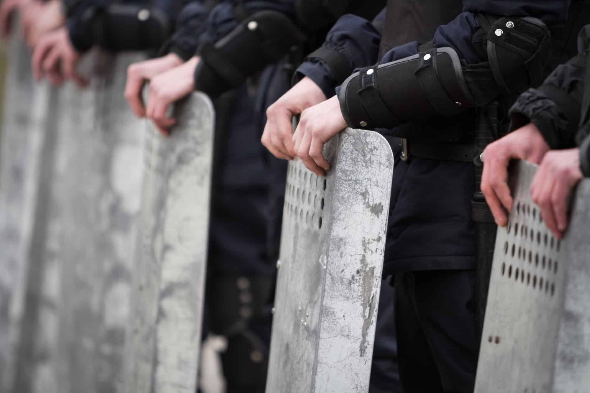 peaceful protesters riot police