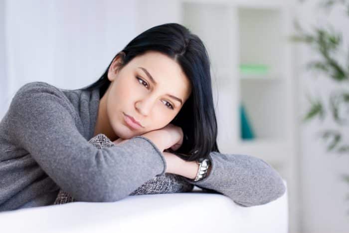 sad woman without paid sick leave