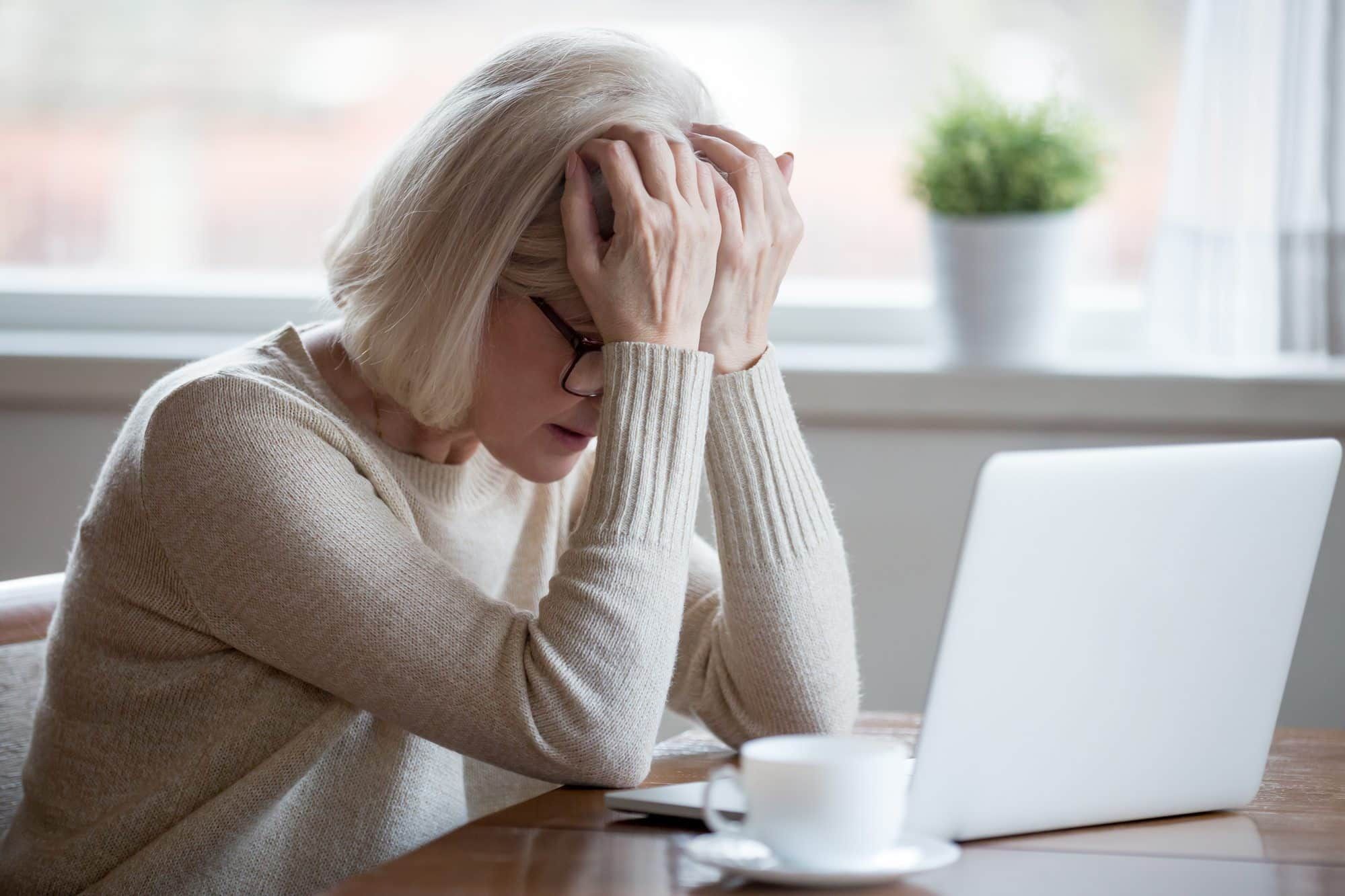 stressed woman working on laptop