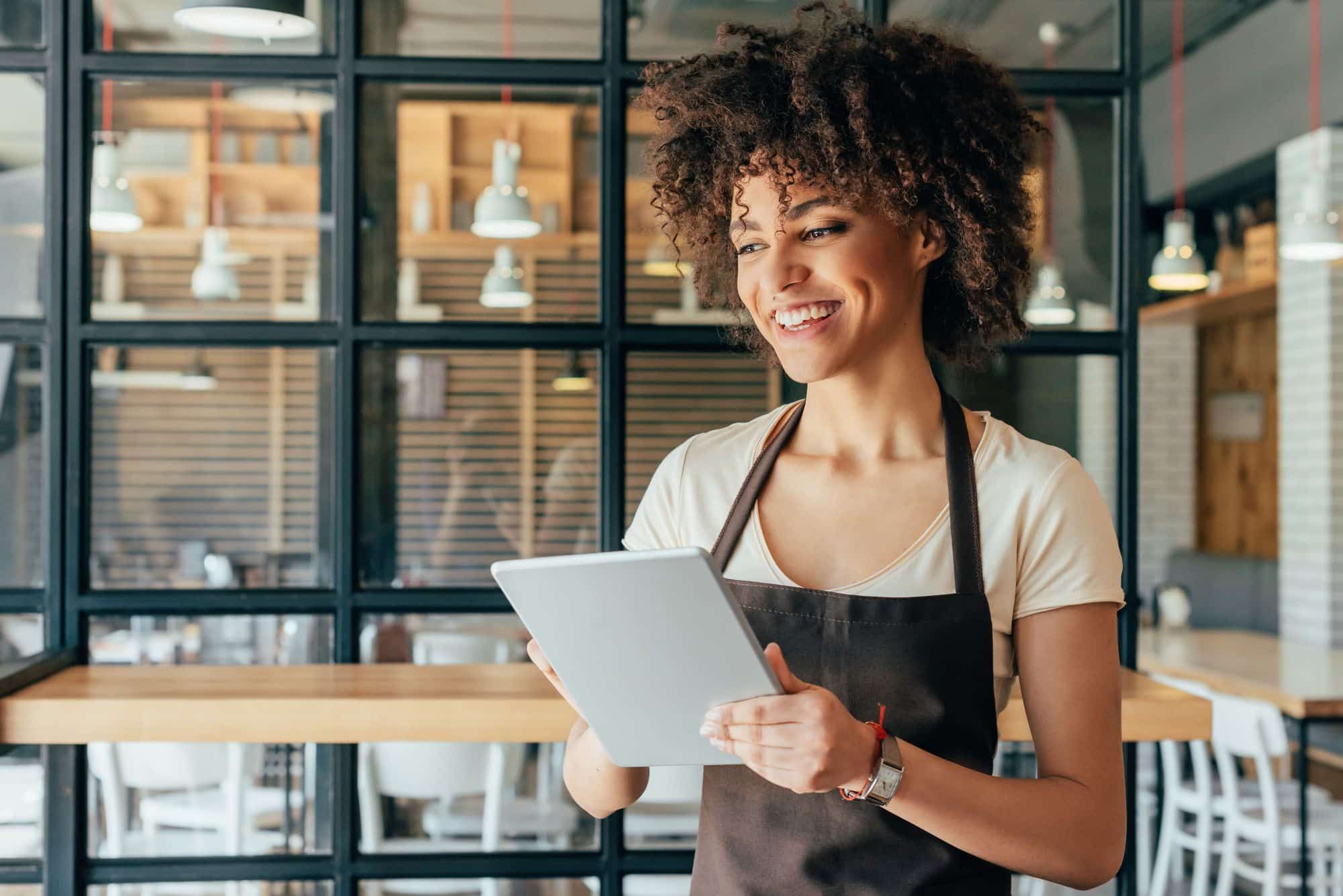 Young waitress takes an order