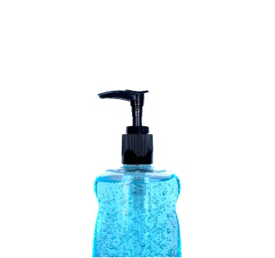 Blue hand sanitizer in a clear bottle with a black pump