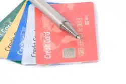 closeup of credit cards and a pen