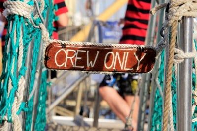 Wooden "crew only" sign on cruise ship