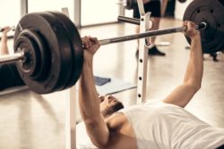 Man lifts barbell at the gym