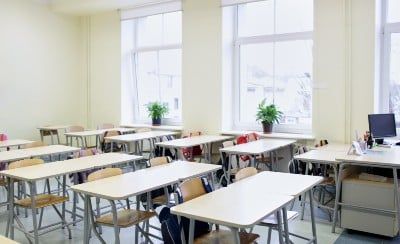 Desks in empty classroom
