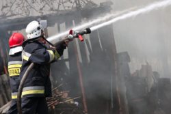 firefighters putting out building fire