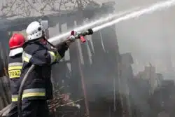 firefighters putting out building fire