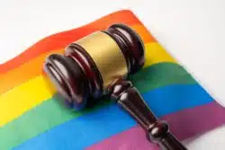 gavel on lgbtq flag, justice for Black Reynolds Tobacco employee