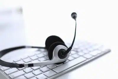 Microphone headset lying on top of keyboard