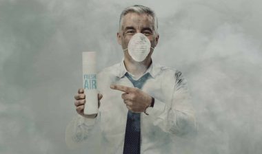 man in face mask selling fresh air