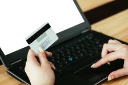 person uses credit card to purchase RNC utilities