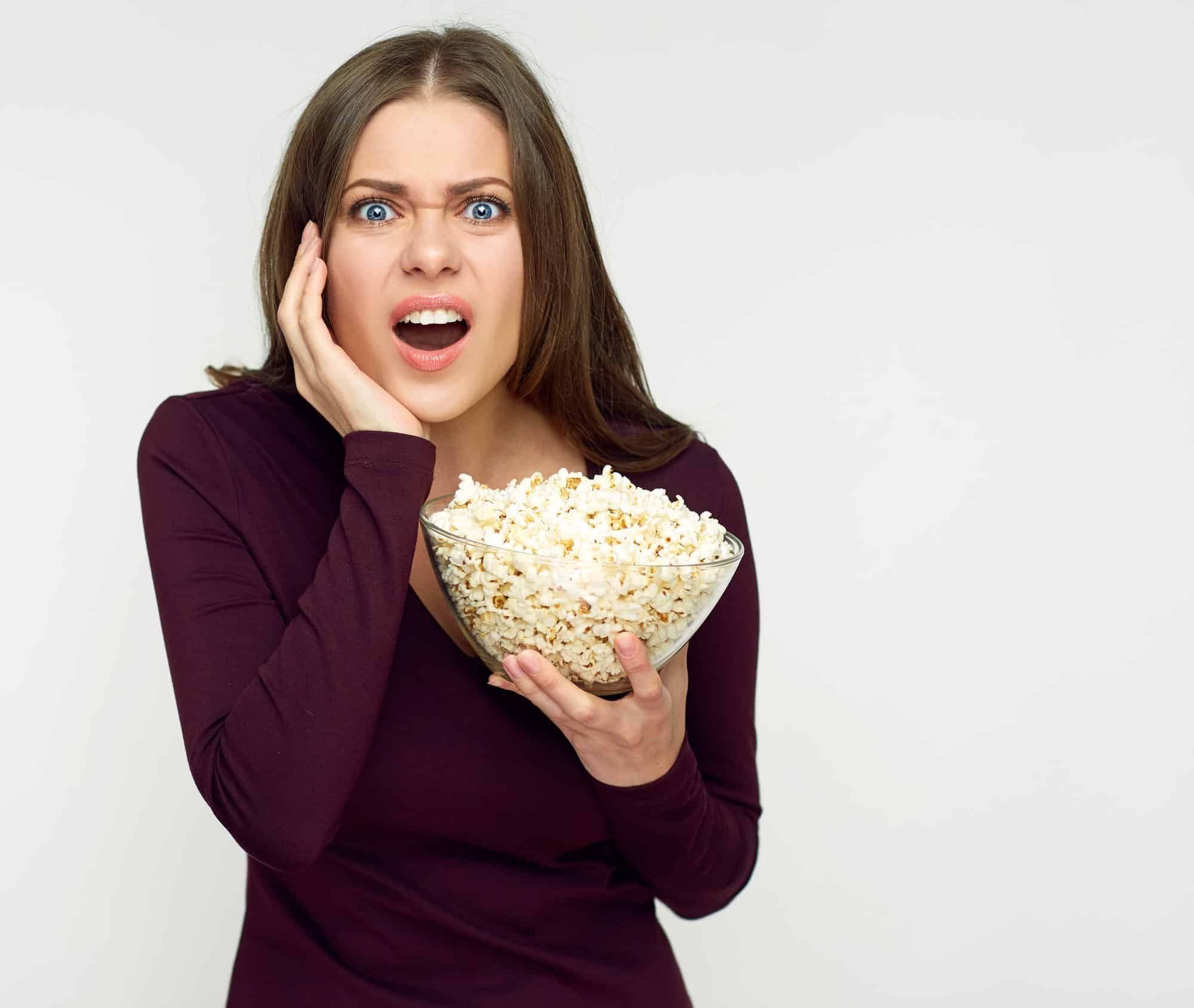 surprised eating Full Circle Market popcorn