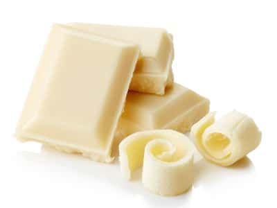 White chocolate bar segments and curls