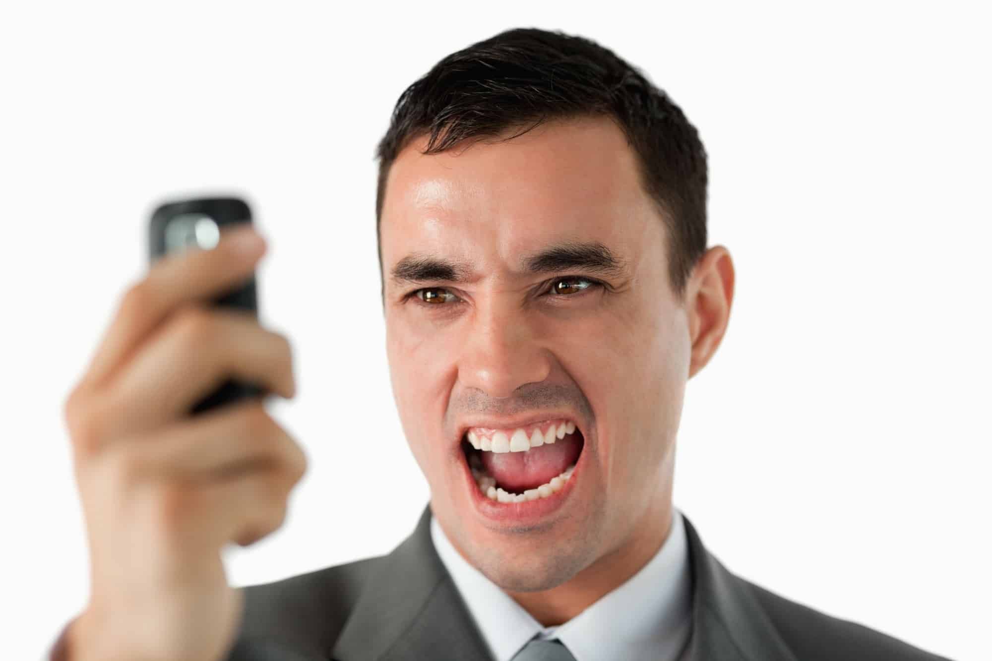 Man upset as he reads text message