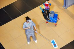 Woman mops floor