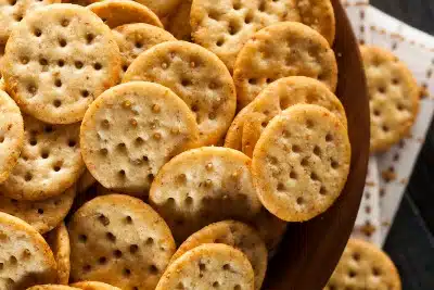 Multigrain crackers in a brown bowl - Trader Joe's crackers