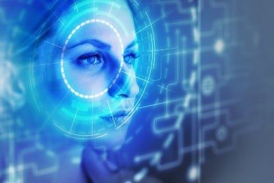 A woman has her face scanned with facial recognition software - Macy's