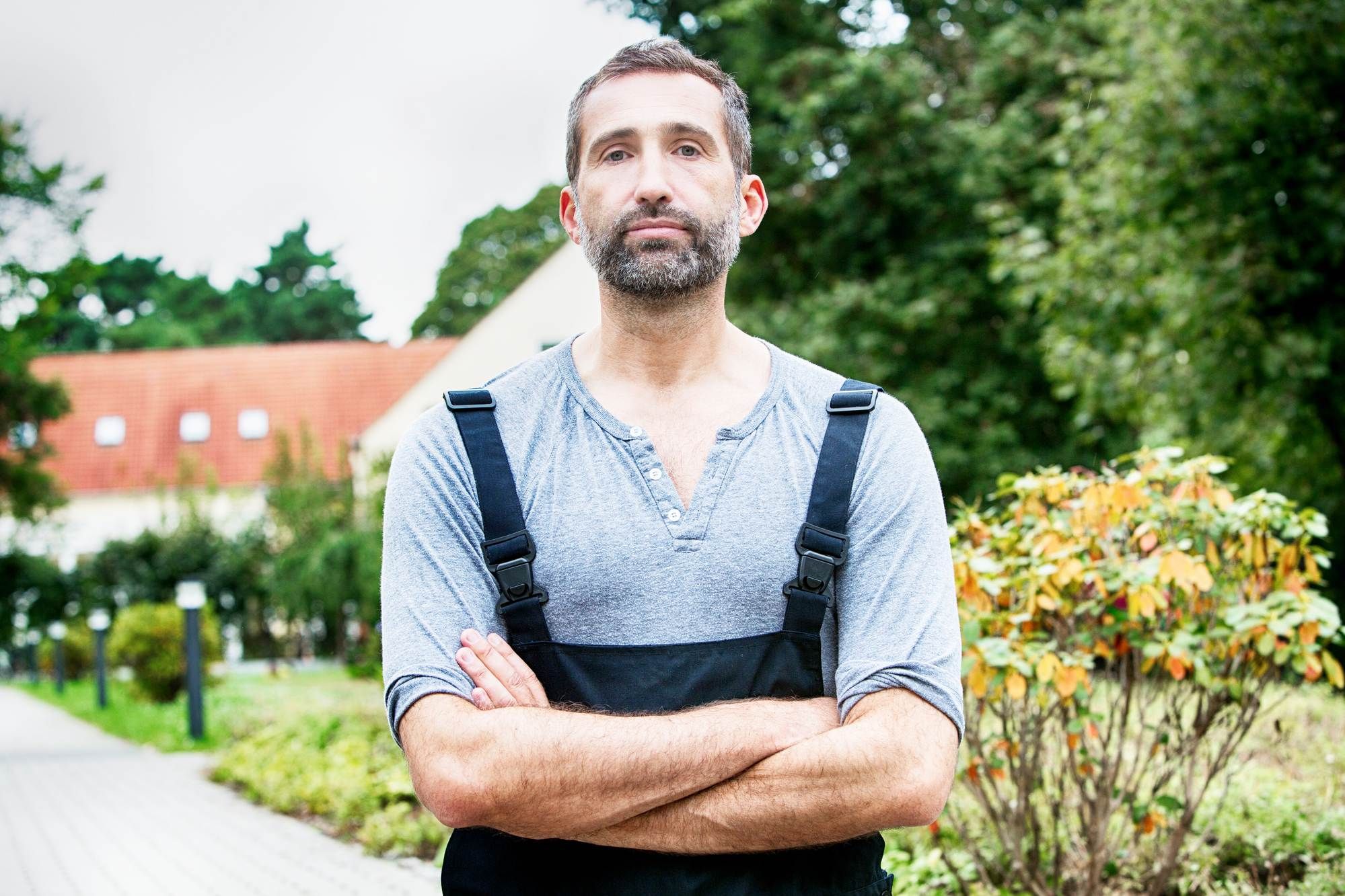 disgruntled gardener or farmer outside