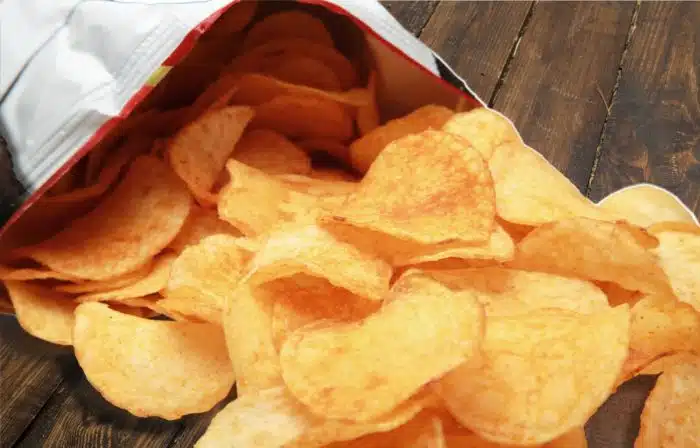 Wise Foods Cheddar and Sour Cream chips falling out of the bag