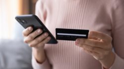woman paying with smart phone