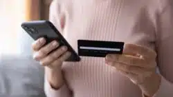 woman paying with smart phone