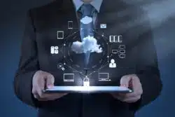 Businessman holds cloud computing diagram