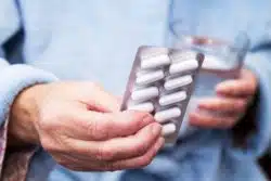 Hand holding a blister pack of pills