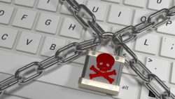 Computer keyboard in lock and chains