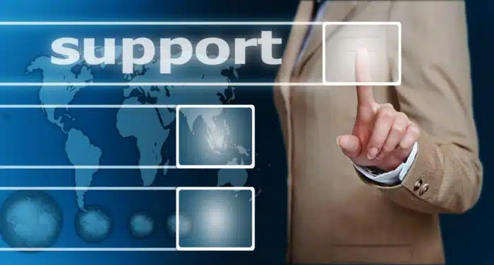 man reaching out for computer tech support