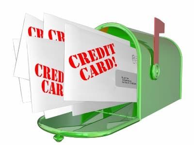 Illustration of a green mailbox full of credit card offer envelopscapital one credit card