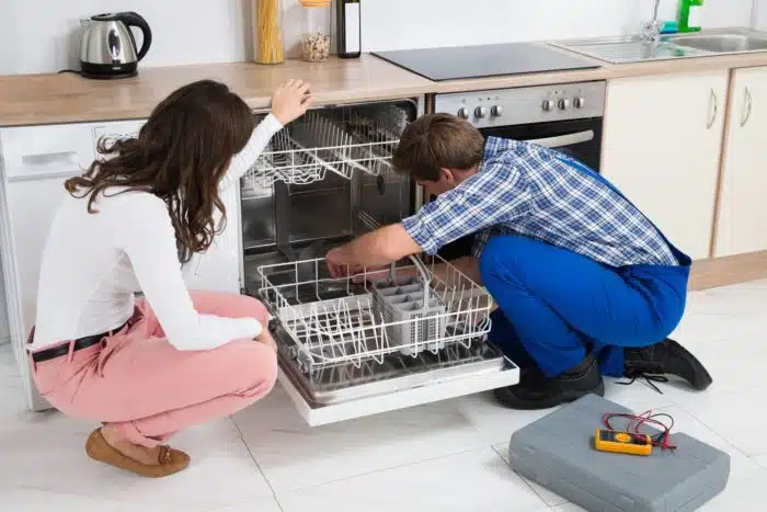 A whirlpool dishwasher getting repaired