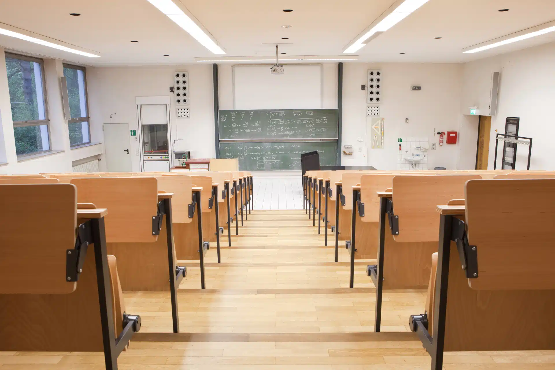 A university lecture hall sits empty - college tuition