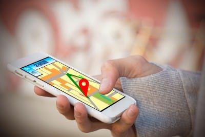 Closeup of person using a GPS app on their smartphone - lyft app